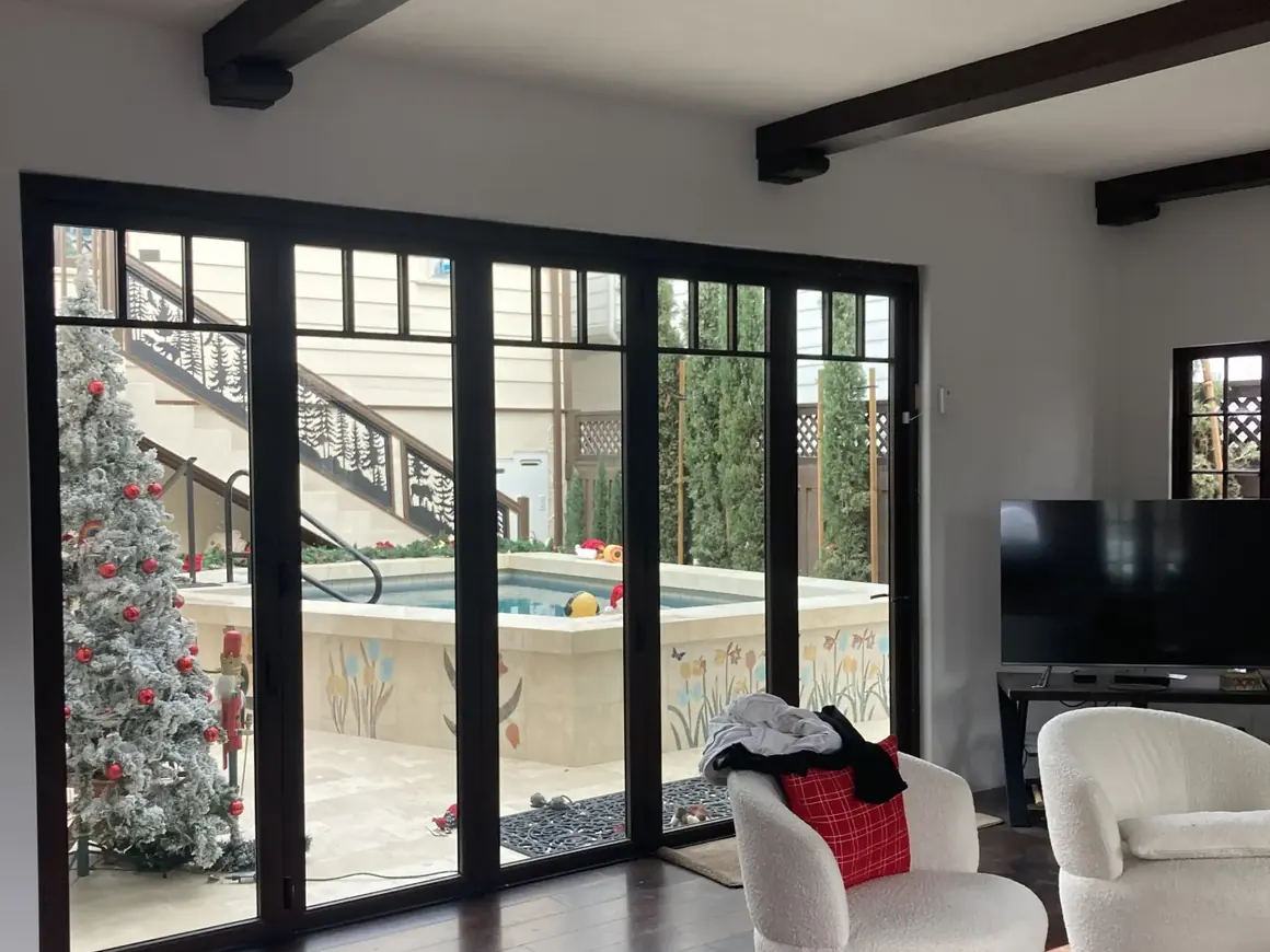 Open great room with folding glass doors after a full interior remodel