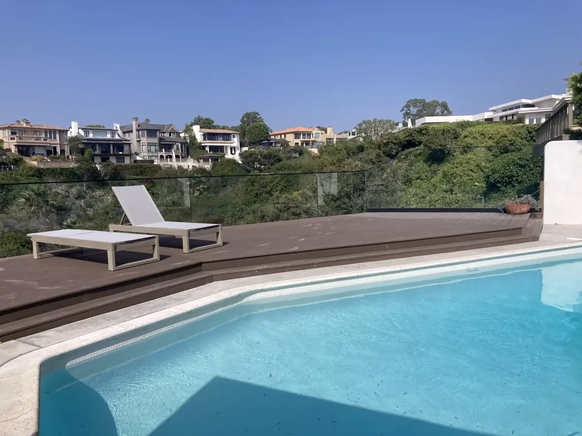 Pool deck and outdoor living area with an ocean-view terrace