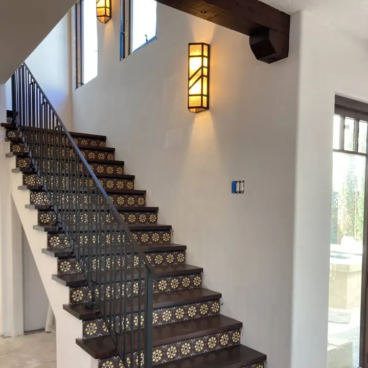 Custom staircase with patterned tile risers