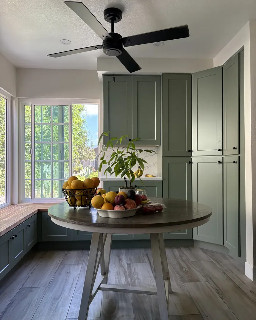 Renovated dining nook with custom cabinetry and garden view